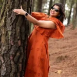 girl hugging tree and smiling