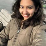 girl smiling and taking selfie