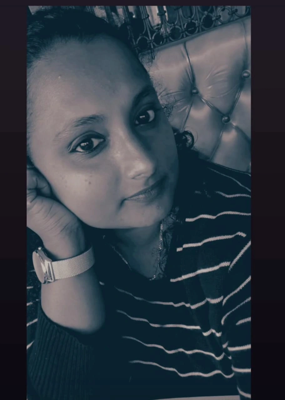 fashion designer in Kochi, Merin, sitting and smiling