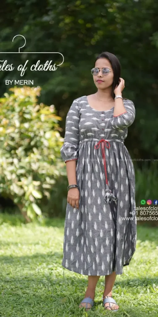 model smiles and poses in dress made by fashion designer in kochi